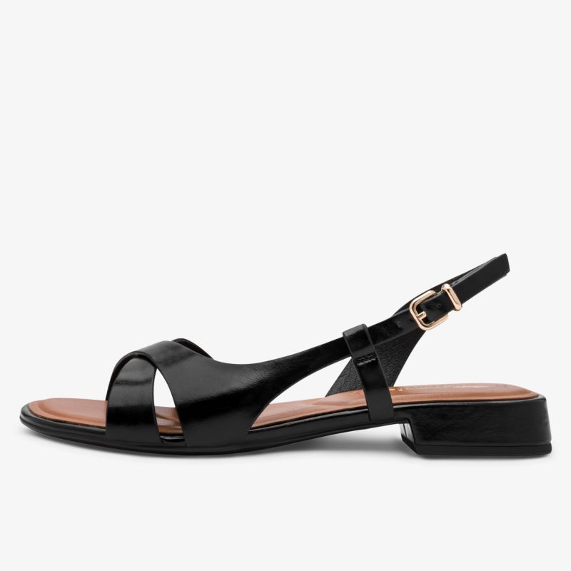 Elegante schwarze Sandale mit flachem Absatz und verstellbarem Riemen für bequemen Halt