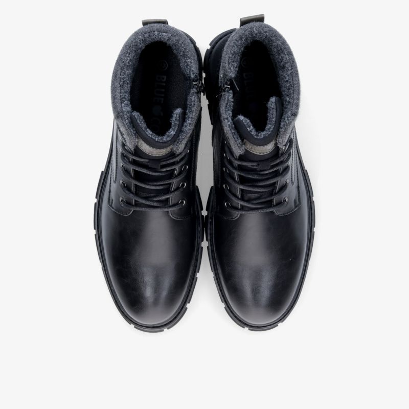 Robuste schwarze Lederstiefel mit warmem Innenfutter und rutschfester Sohle. Perfekt für kalte Temperaturen.