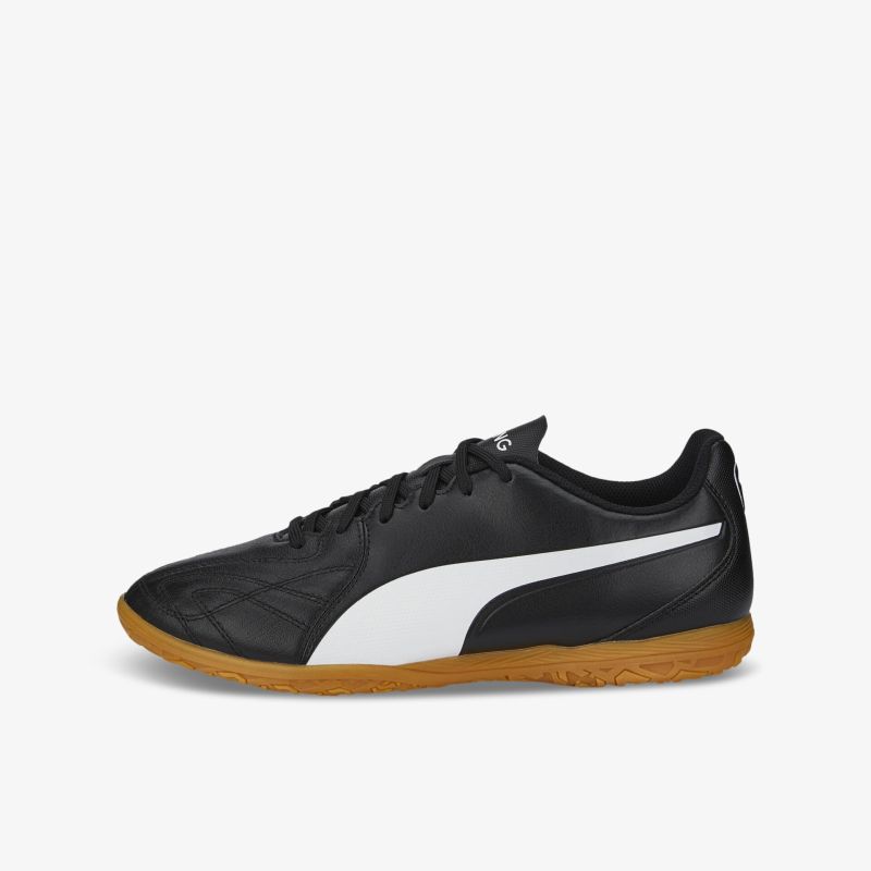 Klassischer Hallenfußballschuh in Schwarz-Weiß mit strapazierfähiger Gummi-Außensohle und komfortabler Passform.